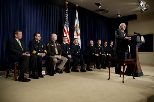 After an introduction by Attorney General John Ashcroft, far left, Vice President Dick Cheney speaks during the Medal of Valor Ceremony in the Dwight D. Eisenhower Executive Office Building Friday, Feb. 14, 2003. The Vice President and Attorney General presented 10 Medals of Valor to public safety officers who put their lives in danger helping people in danger. White House photo by David Bohrer.