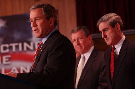 Meeting with federal, state, and local employees, President George W. Bush discusses the creation of the Terrorist Threat Integration Center during a visit to FBI Headquarters in Washington, D.C., Friday, Feb. 14, 2003. White House photo by Tina Hager