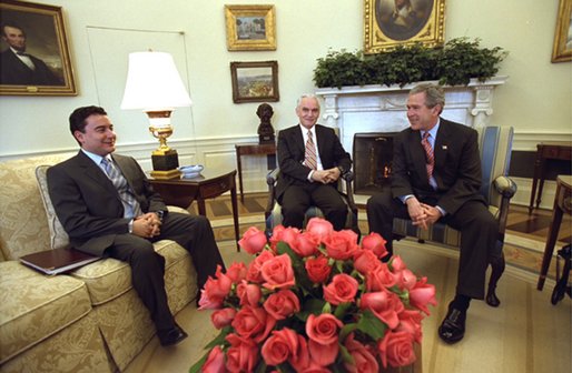 President George W. Bush meets with Yasar Yakis, Foreign Minister of Turkey, center, and Ali Babacan, Minister of State for the Economy of Turkey, in the Oval Office Friday, Feb. 14, 2003. White House photo by Tina Hager