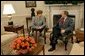 President George W. Bush hosts a visit by Latvian President Vaira Vike-Freiberga in the Oval Office on Presidents' Day, Monday, Feb. 17, 2003. White House photo by Tina Hager.