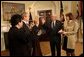 President George W. Bush presides over the swearing-in of William Donaldson as the new chairman of the Securities and Exchange Commission in the Roosevelt Room Tuesday, Feb. 18, 2003. White House photo by Tina Hager