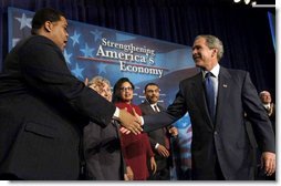 President George W. Bush greets participants during his address regarding job and economic growth at Harrison High School in Kennesaw, Ga., Thursday, Feb. 20, 2003.  White House photo by Eric Draper