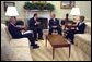 President George W. Bush meets with Secretary of State Colin Powell, left, Secretary of Energy Spencer Abraham, center, and EPA Administrator Christine Todd Whitman in the Oval Office Thursday, Feb. 27, 2003. White House photo by Paul Morse.