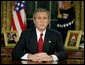 President George W. Bush addresses the nation from the Oval Office at the White House Wednesday evening, March 19, 2003.  White House photo by Paul Morse