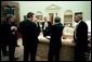 On Wednesday evening, March 19, 2003, President George W. Bush meets with his national security and communications advisors after authorizing military operations. Present, from left, are Steve Hadley, Deputy National Security Advisor; Karen Hughes, special advisor to the President; Chairman of the Joint Chiefs of Staff Richard B. Myers; Dan Bartlett, Communications Director; Vice President Dick Cheney, Secretary of Defense Donald Rumsfeld; National Security Advisor Condoleezza Rice; and Secretary of State Colin Powell. White House photo by Eric Draper.