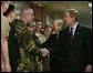 After delivering his remarks, President George W. Bush greets troops at the Pentagon Tuesday, March 25, 2003. White House photo by Paul Morse.