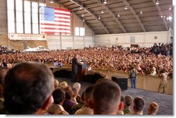 President George W. Bush addresses military personnel inside a hangar at MacDill Air Force Base in Tampa, Florida, Wednesday, March 26, 2003.  White House photo by Paul Morse