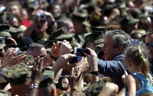 President George W. Bush greets Marines and their families after speaking at Camp Lejeune in Jacksonville, N.C., Thursday, April 3, 2003. White House photo by Paul Morse