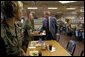 President George W. Bush greets Marines before sitting down with them for lunch at Camp Lejeune in Jacksonville, N.C., Thursday, April 3, 2003. White House photo by Paul Morse