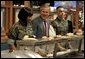 President George W. Bush and Mrs. Bush are served lunch with Marines at Camp Lejeune in Jacksonville, N.C., Thursday, April 3, 2003. White House photo by Paul Morse