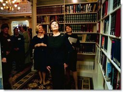 Laura Bush tours the Dwight D. Eisenhower Executive Office Building Library after launching the Executive Office of the President Virtual Library Tuesday, April 8, 2003. "This library is a valuable center of knowledge within the White House. Since it opened 125 years ago, the library has grown from a small reference collection to a modern research facility, with a strong concentration in American history and government," Mrs. Bush said. "Launching the EOP Virtual Library today is a perfect start to National Library Week. This week is not only a celebration of our nation's libraries, but of the people who make them great."  White House photo by Susan Sterner