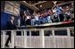 President George W. Bush walks to the stage as workers cheer during his introduction at the Boeing F-18 Production Facility in St. Louis, Mo., Wednesday, April 16, 2003. White House photo by Eric Draper