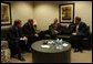 President George W. Bush meets with, from left, William Clay Ford Jr., Chairman & CEO of Ford Motor Company; Dieter Zetsche, President & CEO of Chrysler Group; and Richard Wagoner, President & CEO of General Motors Corp., at the Ford Community and Performing Arts Center in Dearborn, Mich., Monday, April 28, 2003. White House photo by Tina Hager