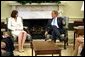 President George W. Bush meets with judicial nominee Priscilla Owen in the Oval Office. File Photo. White House photo by Paul Morse