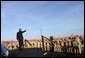 The President acknowledges sailors after addressing the nation from the flight deck of the USS Abraham Lincoln May 1, 2003. White House photo by Paul Morse