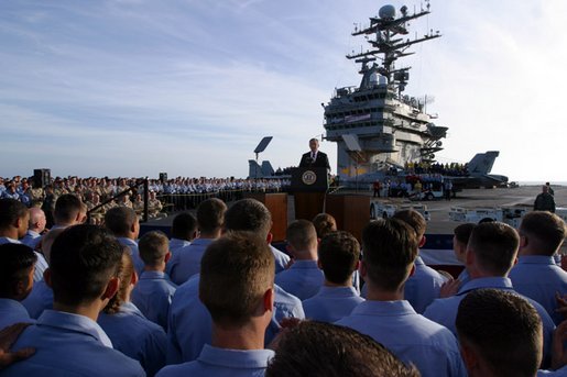 President George W. Bush addresses sailors and the nation from the flight deck of the USS Abraham Lincoln of the coast of San Diego, California May 1, 2003. White House photo by Paul Morse