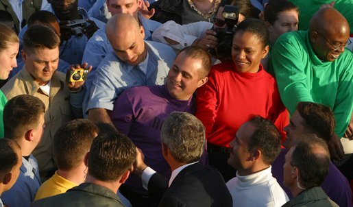 President George W. Bush greets sailors after addressing the nation on the flight deck of the USS Abraham Lincoln off the coast of San Diego, California May 1, 2003. White House photo by Paul Morse