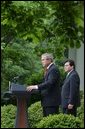 As Counsel Judge Alberto Gonzales stands by his side, President George W. Bush delivers remarks regarding his judicial nominations in the Rose Garden Friday, May 9, 2003. President Bush has sent 34 judicial nominees to the Senate , but only 17 of those nominated have received a vote. White House photo by Tina Hager.