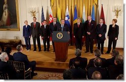 President George W. Bush addresses the Central European Foreign Ministers in the East Room May 8, 2003. "Just hours ago, the United States Senate voted unanimously to support NATO admission for Bulgaria, Estonia, Latvia, Lithuania, Romania, Slovakia and Slovenia," explained President Bush. "These heroic nations have survived tyranny, they have won their liberty and earned their place among free nations. America has always considered them friends, and we will always be proud to call them allies."  White House photo by Tina Hager