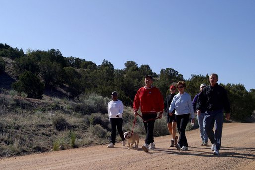 President George W. Bush and Laura Bush walk with Roland Betts, second left, and wife Lois Betts, and other guests Regan and Billy Gammon near the Bett's home outside Santa Fe, N.M., Saturday, May 10, 2003. White House photo by Susan Sterner