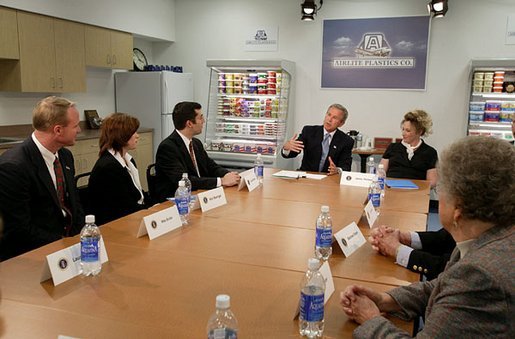 President George W. Bush discusses the tax cuts in his economic plan during a roundtable meeting with couples at Airlite Plastics in Omaha, Neb., Monday, May 12, 2003. White House photo by Susan Sterner