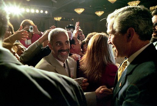 President George W. Bush greets the gathered crowd after addressing the National Hispanic Prayer Breakfast in Washington, D.C., Thursday, May 15, 2003. "It is appropriate that the group sponsoring this breakfast has the name Nueva Esperanza -- New Hope. Hope allows us to dream big, to pray bold, and to work hard for a better future. I want to thank you for your abiding hope, for your steadfast faith, and for your acts of love," said the President in his remarks. White House photo by Eric Draper