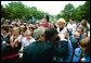 President George W. Bush comforts a woman during the Annual Peace Officers Memorial Service at the U.S. Capitol in Washington, D.C., Thursday, May 15, 2003. "I want to thank all the law enforcement officers who have come here today to honor the fallen," said the President in his remarks. "I particularly want to say to the families, there is a lot of love and compassion in this nation of ours. A lot of people pray for you," White House photo by Paul Morse.