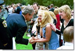 President George W. Bush greets attendees during the Annual Peace Officers Memorial Service at the U.S. Capitol in Washington, D.C., Thursday, May 15, 2003.  White House photo by Paul Morse