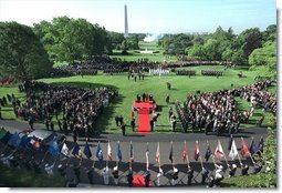 Flags are raised high as President George W. Bush hosts a State Arrival Ceremony for President Gloria Macapagal-Arroyo of the Philippines on the South Lawn Monday, May 19, 2003. "The Philippines was the first democracy in Asia and has a proud tradition of democratic values, love of family and faith in God. President Arroyo, you are carrying this tradition forward, and I'm proud to call you friend," said President Bush in his remarks. "Today the First Lady and I are honored to welcome you and Attorney Arroyo to America and to the White House. Mabuhay!"   White House photo by Paul Morse