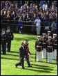 President George W. Bush and President Arroyo review the troops. White House photo by Paul Morse