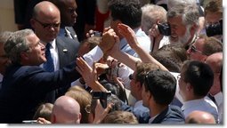 President George W. Bush greets the audience following his speech in the courtyard of the Wawel Royal Palace in Krakow, Poland, Saturday, May 31, 2003.  White House photo by Paul Morse