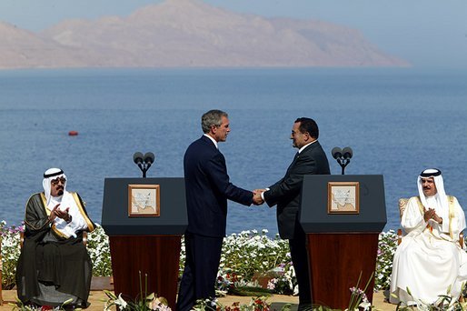 President George W. Bush and President Hosni Mubarak of Egypt after delivering statements on the progress of the Red Sea Summit in Sharm El Sheikh, Egypt June 3, 2003. On the far left sits Prince Abdullah Bin Abd Al Aziz of Saudi Arabia and on the far right sits King Hamad Bin Issa Al Khalifa of Bahrain. White House photo by Paul Morse.