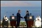 President George W. Bush and President Hosni Mubarak of Egypt after delivering statements on the progress of the Red Sea Summit in Sharm El Sheikh, Egypt June 3, 2003. On the far left sits Prince Abdullah Bin Abd Al Aziz of Saudi Arabia and on the far right sits King Hamad Bin Issa Al Khalifa of Bahrain. White House photo by Paul Morse.