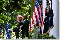 President George W. Bush and Secretary of Education Rod Paige discuss the progress of the No Child Left Behind Act in the Rose Garden Tuesday, June 10, 2003. "(The Act) requires every state in our country to submit an accountability plan that leads to measurable gains in student performance," said the President. "As of today, all of the states, plus Puerto Rico and the District of Columbia, have now submitted those plans."  White House photo by Susan Sterner