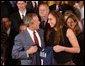 Congratulating the NCAA Winter Championship teams, President George W. Bush stands with Diana Taurasi of the University of Connecticut's women's basketball team in the East Room Tuesday, June 17, 2003. White House photo by Tina Hager