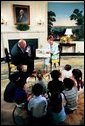 Laura Bush reads to children during an appearance on a morning show broadcast from the Diplomatic Reception Room in the White House, June 25, 2003. White House photo by Susan Sterner