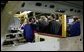 President George W. Bush meets one-on-one with workers at the Ford Motor Company plant near Pretoria, South Africa, Wednesday, July 9, 2003. White House photo by Paul Morse