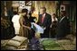 President George W. Bush participates in a tour of the Southern Africa Global Competitiveness Hub with President Festus Gontebanye Mogae of Botswana Thursday, July 10, 2003.