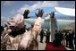 Nigerian President Olesugun Obasanjo waves to President Bush and Laura Bush as they depart from Abuja, Nigeria on July 12, 2003 White House photo by Paul Morse.