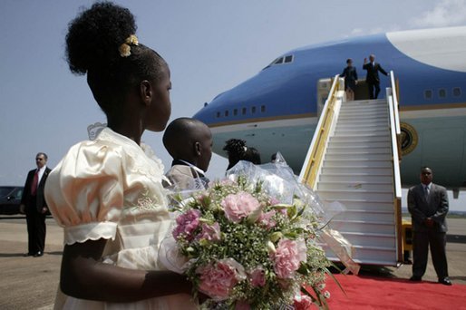 President George W. Bush and Mrs. Laura Bush arrive in Entebbe, Uganda Friday, July 11, 2003. White House photo by Paul Morse.