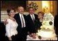 President George W. Bush and Laura Bush pose with former President Gerald R. Ford and wife Betty Ford during the presentation of the birthday cake at the Dinner in Honor of President Ford's 90th Birthday at the White House, Wednesday, July 16, 2003. White House photo by Eric Draper.