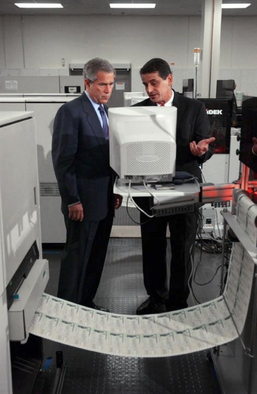 President George W. Bush and regional director Mike Colarusso tour the Department of the Treasury's Philadelphia Financial Management Service Facility July 24, 2003. White House photo by Tina Hager