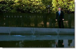 President George W. Bush tours the Korean War Veterans Memorial in Washington, D.C., Friday, July 25, 2003. "This memorial is -- and those who served in Korea also remind us of the challenges we face today, and it gives us a chance to reflect on the sacrifices that are being made on behalf of freedom today. And our nation will be eternally grateful for the men and women who serve today, as we are for those who have served in the past," said the President to the press at the memorial. Sunday, July 27, marks the 50th anniversary of the signing of the armistice that ended the Korean War.  White House photo by Paul Morse