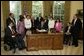 In honor of the 13th anniversary (July 26, 2003) of the Americans with Disabilities Act, President George W. Bush signs the executive order renaming the President's Committee on Mental Retardation to the President's Committee for People with Intellectual Disabilities (PCPID) in the Oval Office Friday, July 25, 2003. In addition to witnessing the signing, the PCPID were on hand to hear President Bush record his weekly radio address. White House photo by Paul Morse.