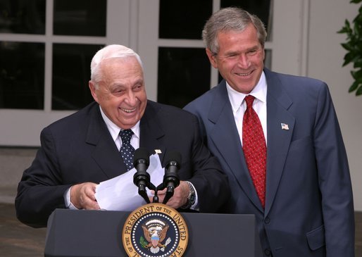 President George W. Bush and Israeli Prime Minister Ariel Sharon laugh together during their joint press conference in the Rose Garden Tuesday, July 29, 2003. White House photo by Paul Morse.