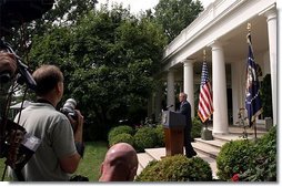 President George W. Bush addresses the media during a Rose Garden news conference Wednesday, July 30, 2003. President Bush discussed many topics including progress in Iraq, the Middle East, and the economy.  White House photo by Paul Morse