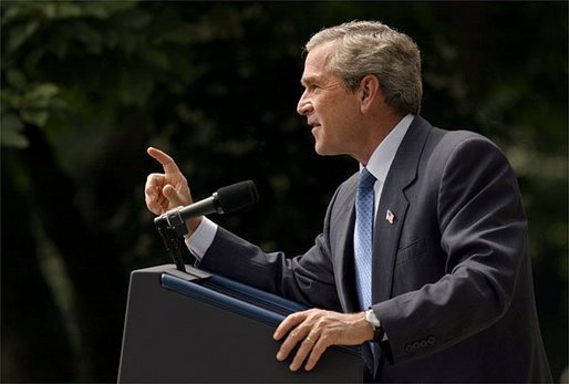 President George W. Bush addresses the media during a Rose Garden news conference Wednesday, July 30, 2003. President Bush discussed many topics including progress in Iraq, the Middle East, and the economy. White House photo by Paul Morse