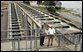 President George W. Bush talks with Witt Anderson during a tour of the Ice Harbor Lock and Dam in Burbank, Wash., Friday,August 22, 2003. White House photo by Paul Morse.