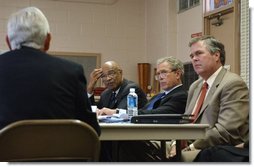 President George W. Bush is briefed on tools available for parents and teachers through the No Child Left Behind Act at Hyde Park Elementary School in Jacksonville, Fla., Tuesday, Sept. 9, 2003.  White House photo by Tina Hager