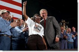 Receiving an enthusiastic welcome, President George W. Bush visits Detroit Edison's Monroe Power Plant in Monroe, Mich., Monday, Sept. 15, 2003.  White House photo by Tina Hager